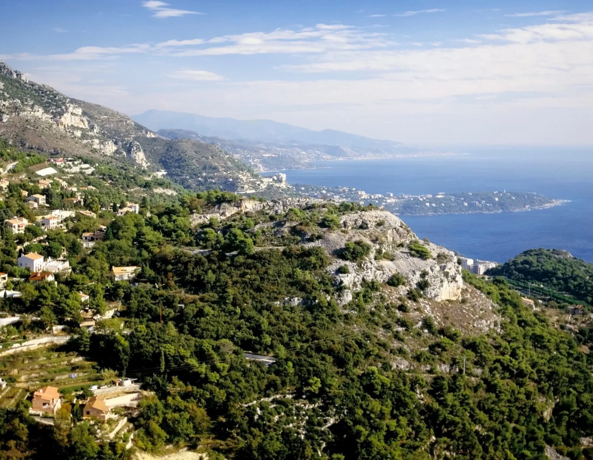 Coastal mountains overlooking the Mediterranean Sea with scattered villas and green foliage