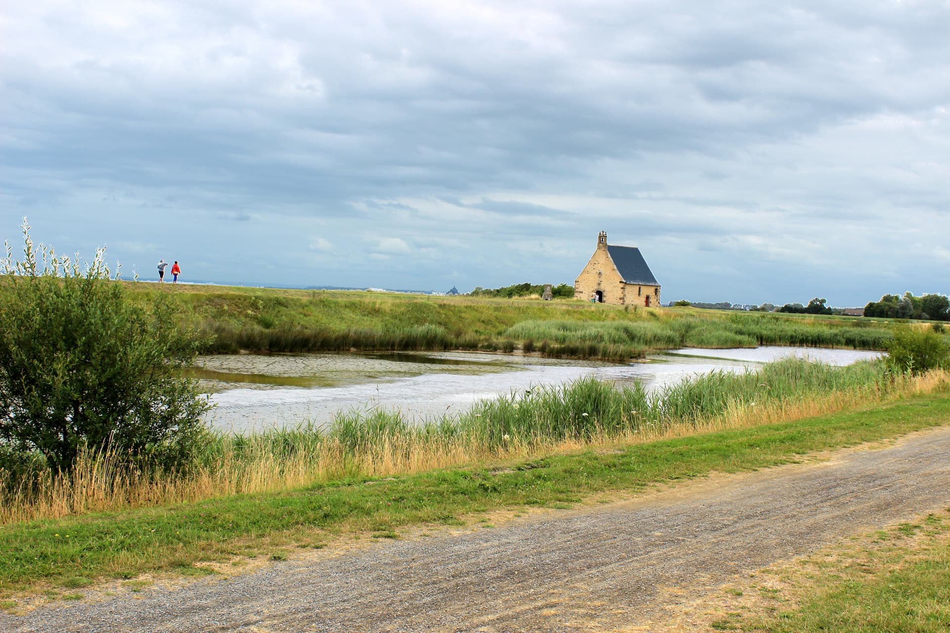 Chapelle Sainte-Anne-de-la-Grève near Saint-Broladre, stone chapel by marshy water.