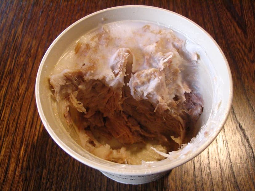 Rillettes de Tours in a container on a wooden table