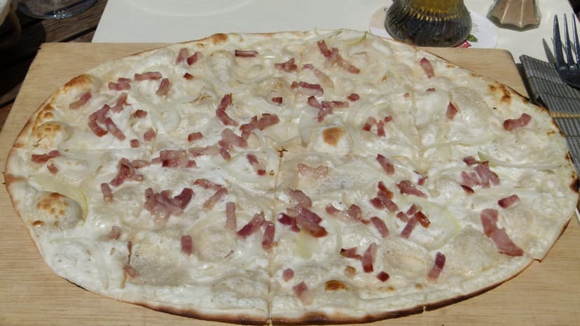 Flammekueche tart flambée with bacon and onions in Strasbourg