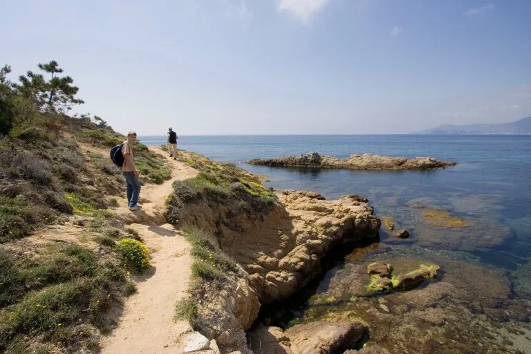 boy with his father on a hiking trail in the cliffs